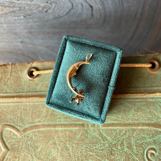 14k yellow crescent moon silver cherub climbing charm